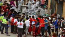 (FILES) In this file photo taken on May 19, 2021 migrant minors wait to be tested for COVID-19 upon their arrival to the Spanish enclave of Ceuta. - Days after up to 10,000 people surged across the Moroccan border into Spain's Ceuta, many hundreds are still here, mostly minors, posing a quandary for this tiny north African territory. (Photo by Antonio Sempere / AFP) / Restricted to editorial use - To illustrate the event as specified in the caption
